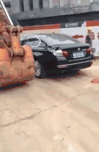 one way to move an illeagly parked car.gif