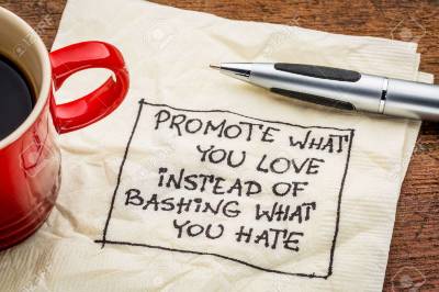 romote-what-you-love-instead-of-bashing-what-you-hate-handwriting-on-a-napkin-with-cup-of-coffee.jpg