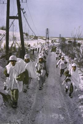 190-8176637-Soldiers_march_down_a_snowy_track_running_through_the_western_fr-a-120_1585754588777.jpg