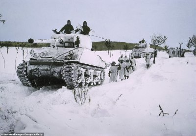 900-8176637-Troops_tread_through_the_snow_behind_a_tank_The_tank_offers_prot-a-106_1585754909727.jpg