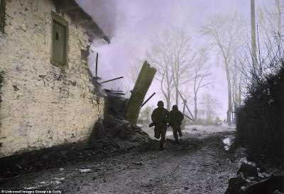892-8176637-Two_soldiers_sprint_past_a_building_while_under_heavy_shellfire_-a-115_1585754910251.jpg