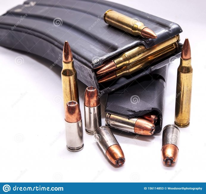 two-loaded-magazines-one-caliber-rifle-other-mm-pistol-along-additional-bullets-each-two-loade...jpg