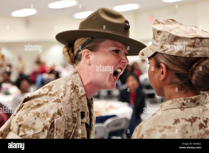 a-us-marine-corps-drill-instructor-screams-at-a-marine-recruit-during-D6XJN2.jpg